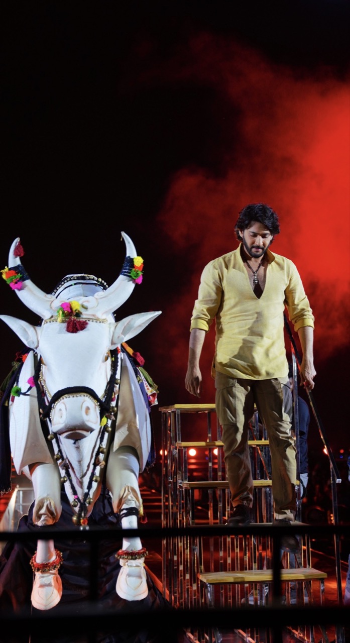 Mahesh Babu beside a decorated white bull in official Varanasi promotional artwork